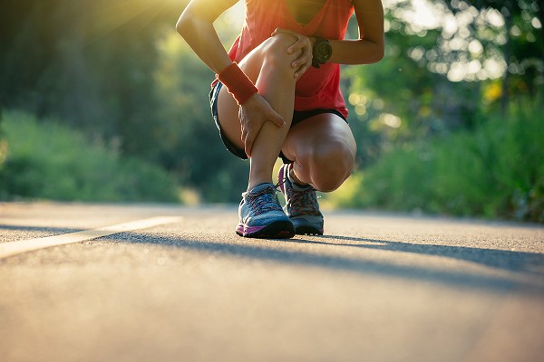 Female Runner Suffers Sports Injury